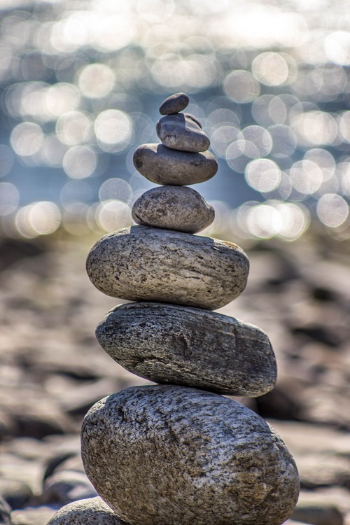 stacked beach rocks in water