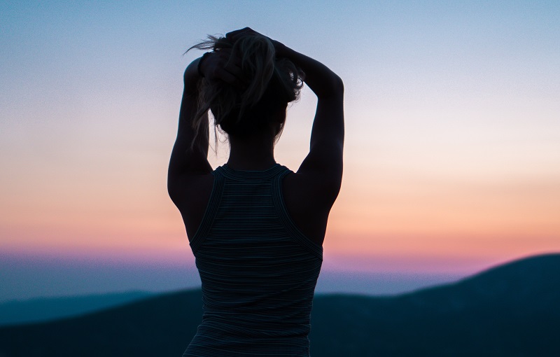 woman looking at sunset